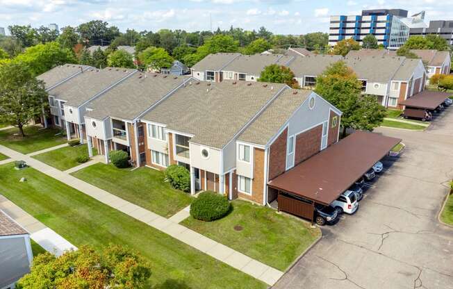 an aerial view of a row of houses with a parking lot