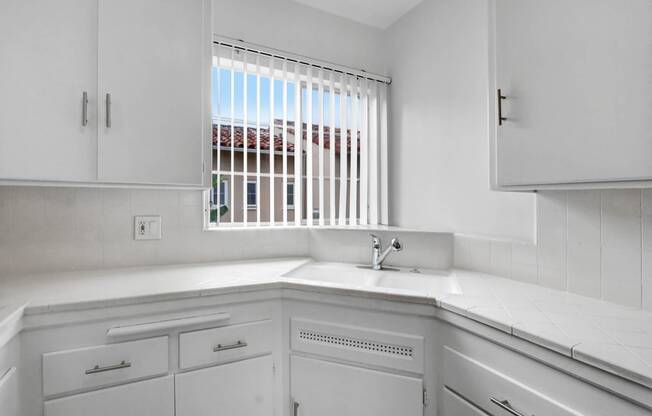 a kitchen with a sink and a window