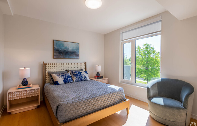 Bedroom With Expansive Windows at Park77, Cambridge