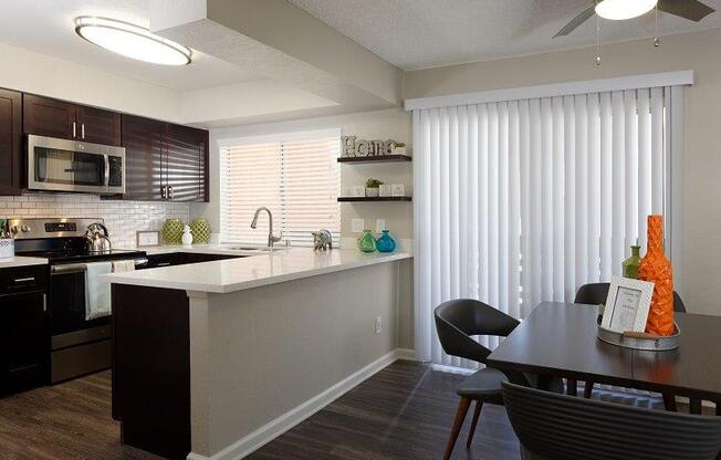 Model kitchen and dining area at Horizon Apartments in Santa Ana, California