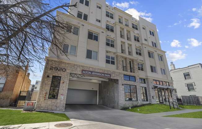 an apartment building with a large garage door in front of it at Alton Jefferson Park, Denver