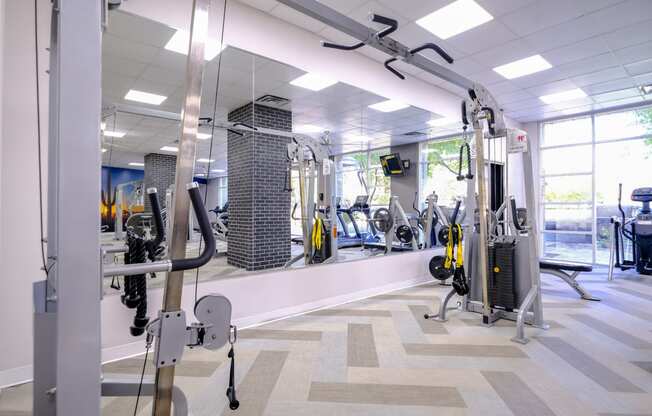 fitness center with weights and strength training equipment at Roosevelt Square apartments