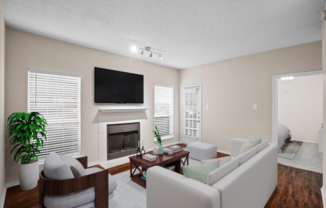 a living room with a fireplace and a tv