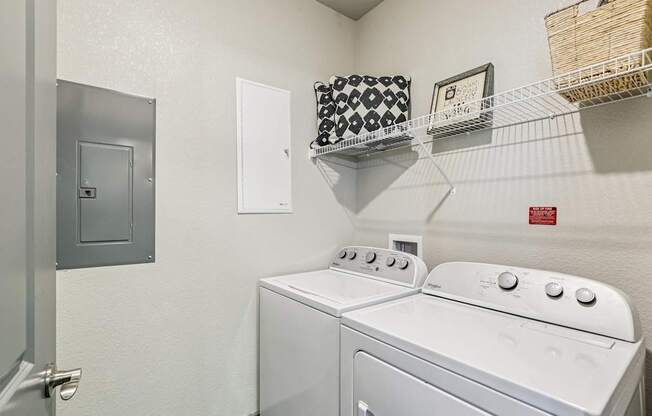 Full-size washer and dryer unit in laundry area at Lotus at Starkey Ranch in Odessa, Florida.