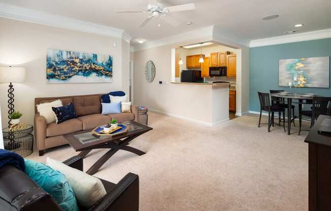 Living Room With Kitchen View at Abberly Place at White Oak Crossing Apartments, HHHunt Corporation, Garner, 27529