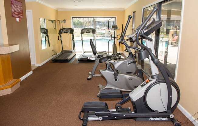 Gym with four elliptical machines at Laurel Grove Apartment Homes, Orange Park, FL, 32073