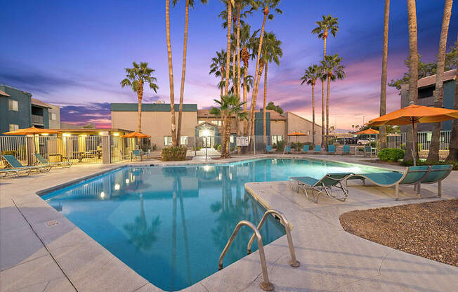 Community Swimming Pool with Pool Furniture at Tanque Verde Apartments located in Tucson, AZ.