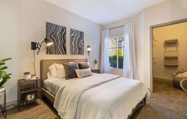 a bedroom with a bed and a window at Mirasol Apartments, Las Vegas, Nevada