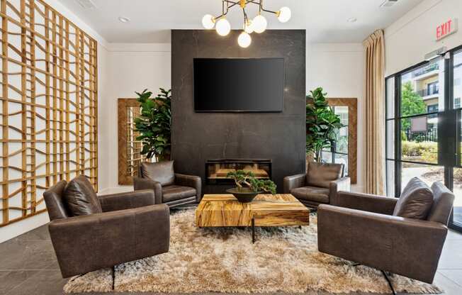 a living room with a fireplace and a tv on the wall