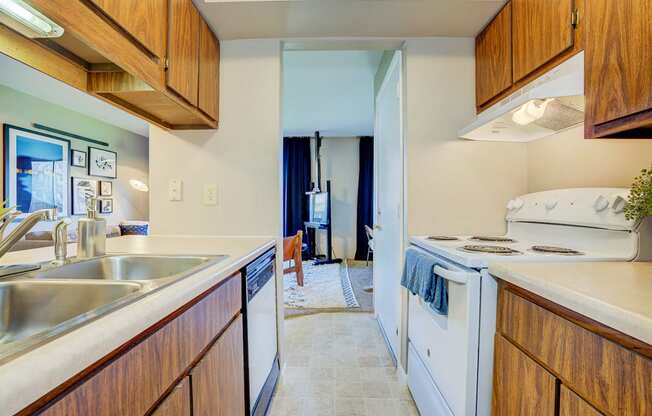 Modern Kitchen With White Appliances at Autumn Woods Apartments, Miamisburg, OH, 45342