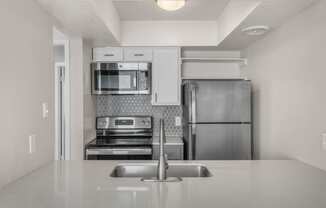 a kitchen with stainless steel appliances and a sink