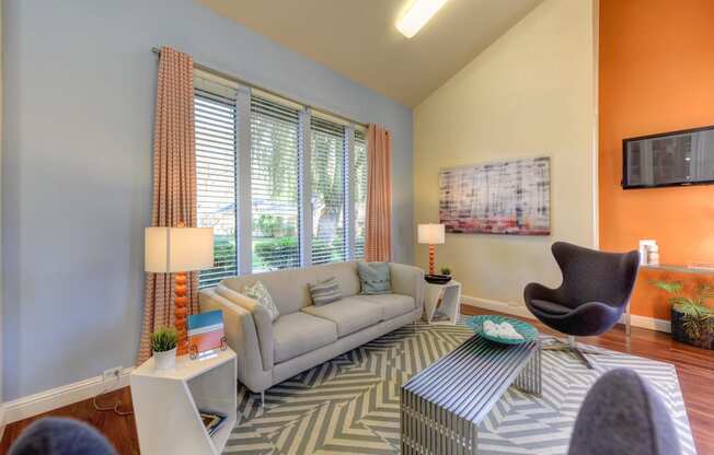 The Pinecrest Apartment Leasing office with seating options, coffee table and large windows. at Pinecrest Apartments, Davis, CA, 95616