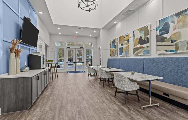 A modern dining area with a long table and chairs.