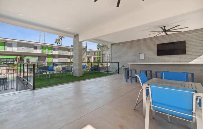 Covered outdoor lounge space near pool