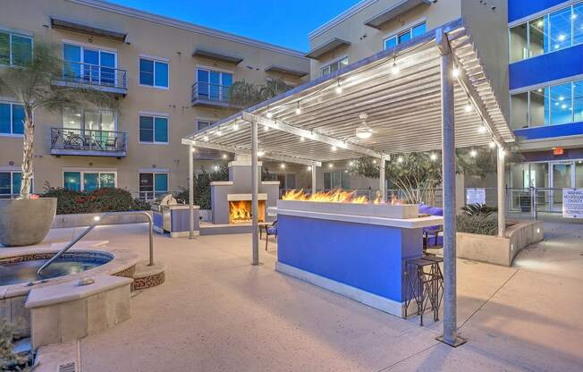 outdoor kitchen and fireplace on the luxurious pool patio at The Mosaic on Broadway, Texas, 78215
