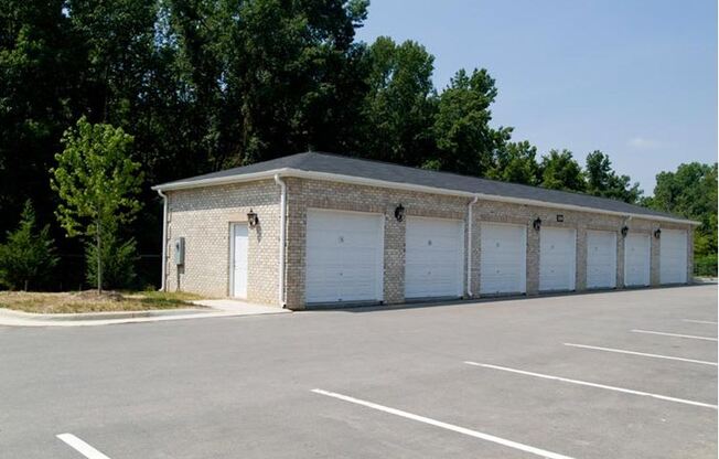 A building with a parking lot in front of it.