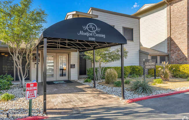 The front of a leasing center with a "No Parking" sign.