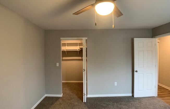 bedroom with carpet and closet