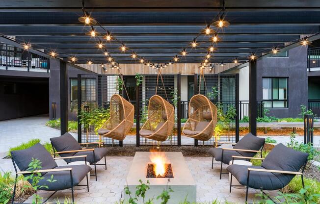 Sink into the unique comfort of our hanging lounge chairs, surrounded by vibrant greenery.