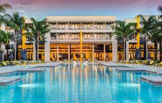 a large swimming pool with a large building in the background  at Fusion, Jacksonville, Florida