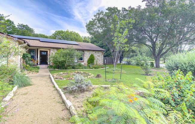 Freshly Updated 4 Bed Home with Solar Panels & Incredible Native Landscaping