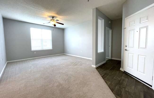 Living room with a ceiling fan at The Chase, Burlington, NC 27215