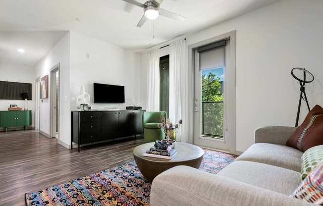 Bright Living Room with Modern Decor and Balcony Access