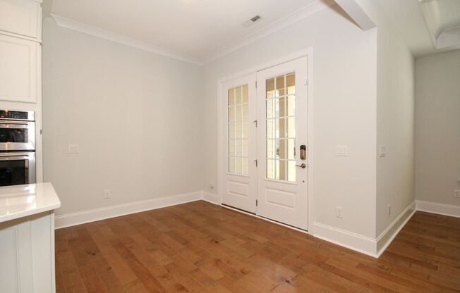 Beautiful John Wieland end unit townhouse never lived in, located in the heart of Waverly.