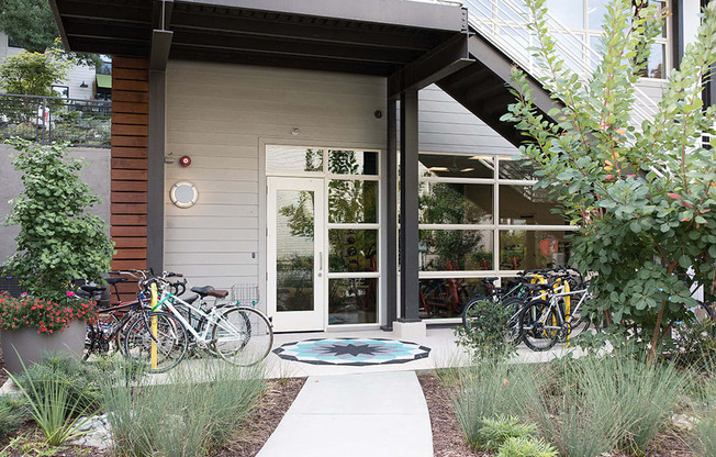 A modern house with a bicycle parked in front.