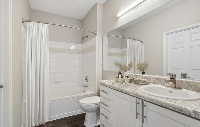Bathroom with a shower toilet and sink
