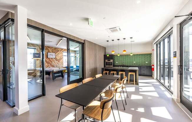 A conference room with a long table and chairs.
