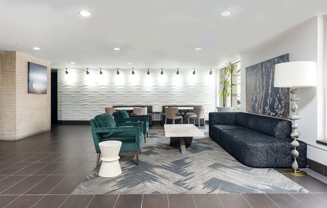 a lobby with couches and chairs and a table