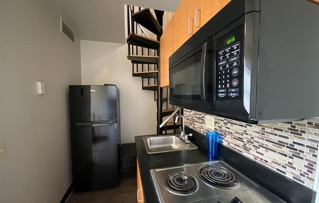 a kitchen with a stove and a microwave