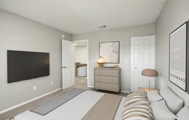 Model bedroom with a bed and a dresser