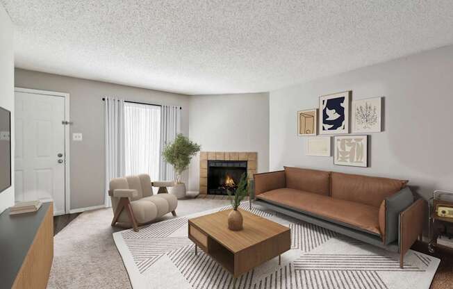 A living room with a fireplace, couch, and artwork on the wall.