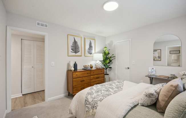 a bedroom with a bed and a closet at St. Andrews Reserve, North Carolina, 28412