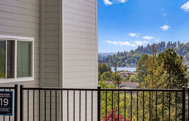 a balcony with a view of a city and a river