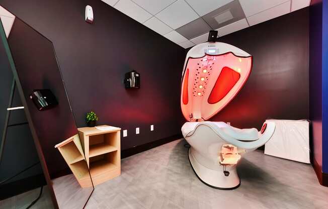 a treatment room with a toilet and a chair and aigmigmigmizophrenia