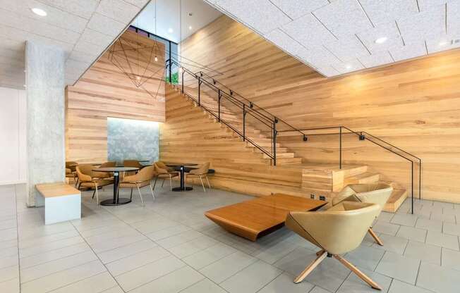 Contemporary Lobby Lounge with Statement Wood Staircase