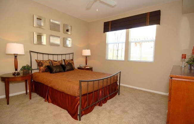 Bedroom with windows, nightstand