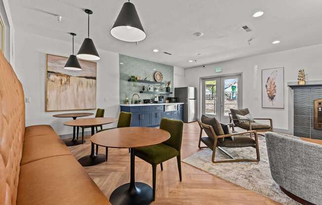 A modern living room with a brown leather sofa and a green chair.