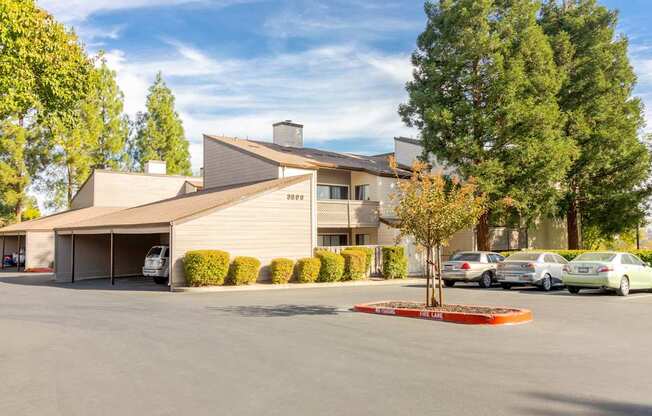 A large building with a parking lot in front of it.