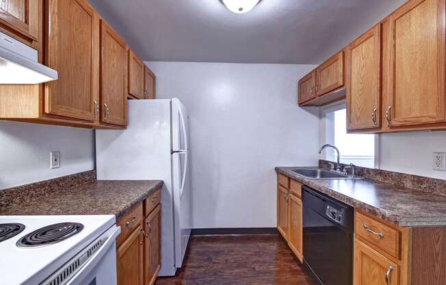 Updated Kitchen with Marbled Brown Countertops at Highland Cub Apartments, Watervliet