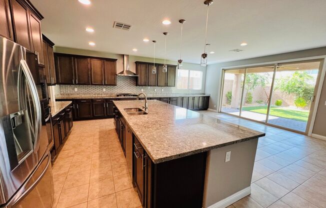 Stunning and spacious 4 Bed 3 bath 3,602 SQFT home inside Rhodes Ranch Guard Gated Golf Course Community!