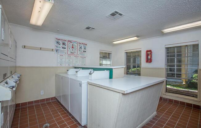 a kitchen with a tile floor