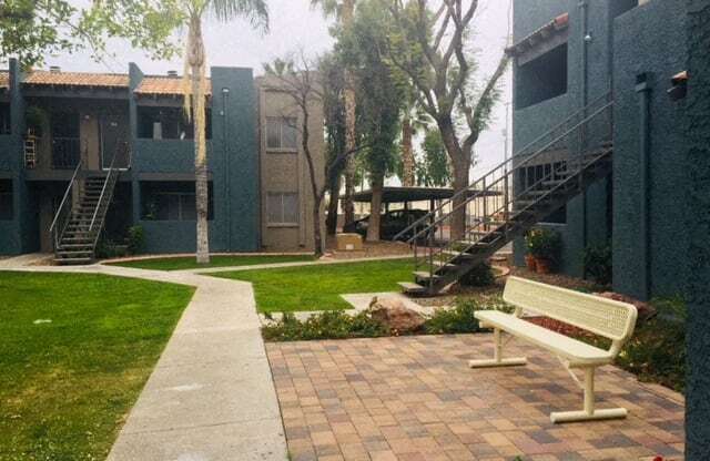 a bench sitting in front of a building