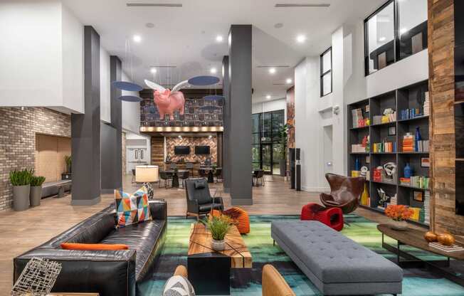 a living room with couches and chairs and a fireplace