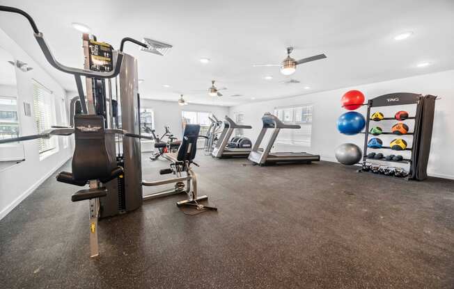 a workout room with treadmills and other exercise equipment  at Union at Wiley, Cedar Rapids, 52404