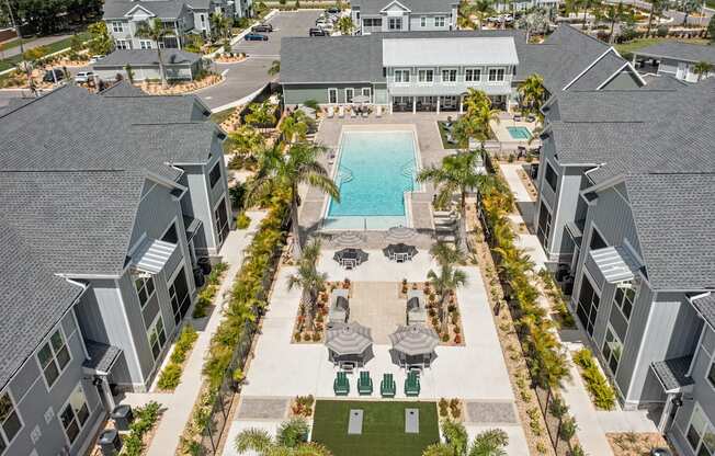 an aerial view of a swimming pool in a row of houses at Palm Grove in Ellenton, FL 34222