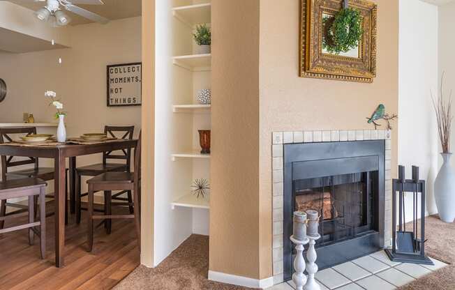 Ridgepointe living room with carpet flooring and nice cozy fireplace